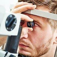 Young man having an eye exam