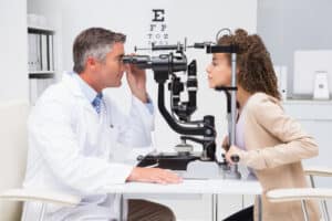doctor examining woman's eye anatomy
