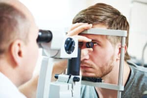 doctors examining a patient's eyes