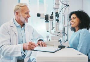 eye doctor consulting patient about istent